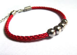 National wind men and women lovers bracelet hand rope Handmade beaded alloy four bead red rope bracelet can be adjusted